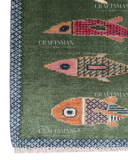 Hand Knotted Wool Fish Pattern Rug | Green Tribal Artisan Carpet with Blue Geometric Border | Luxury Handmade Area Rug
